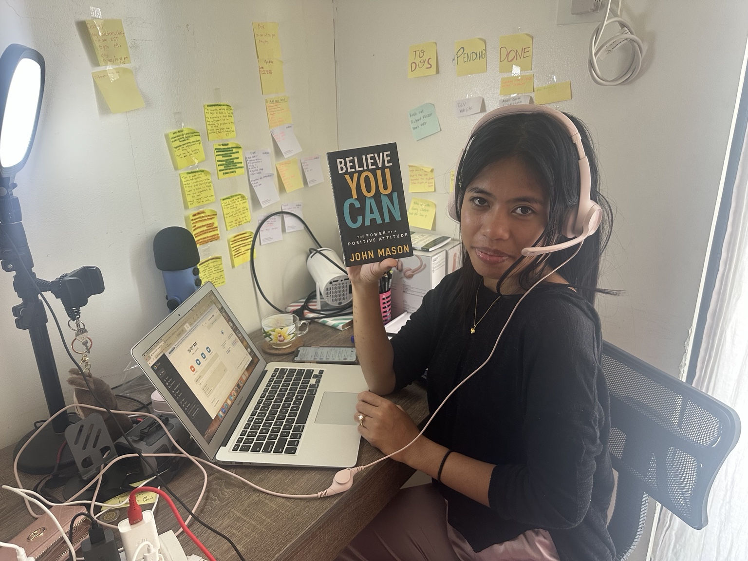 Filipina remote professional at a workstation